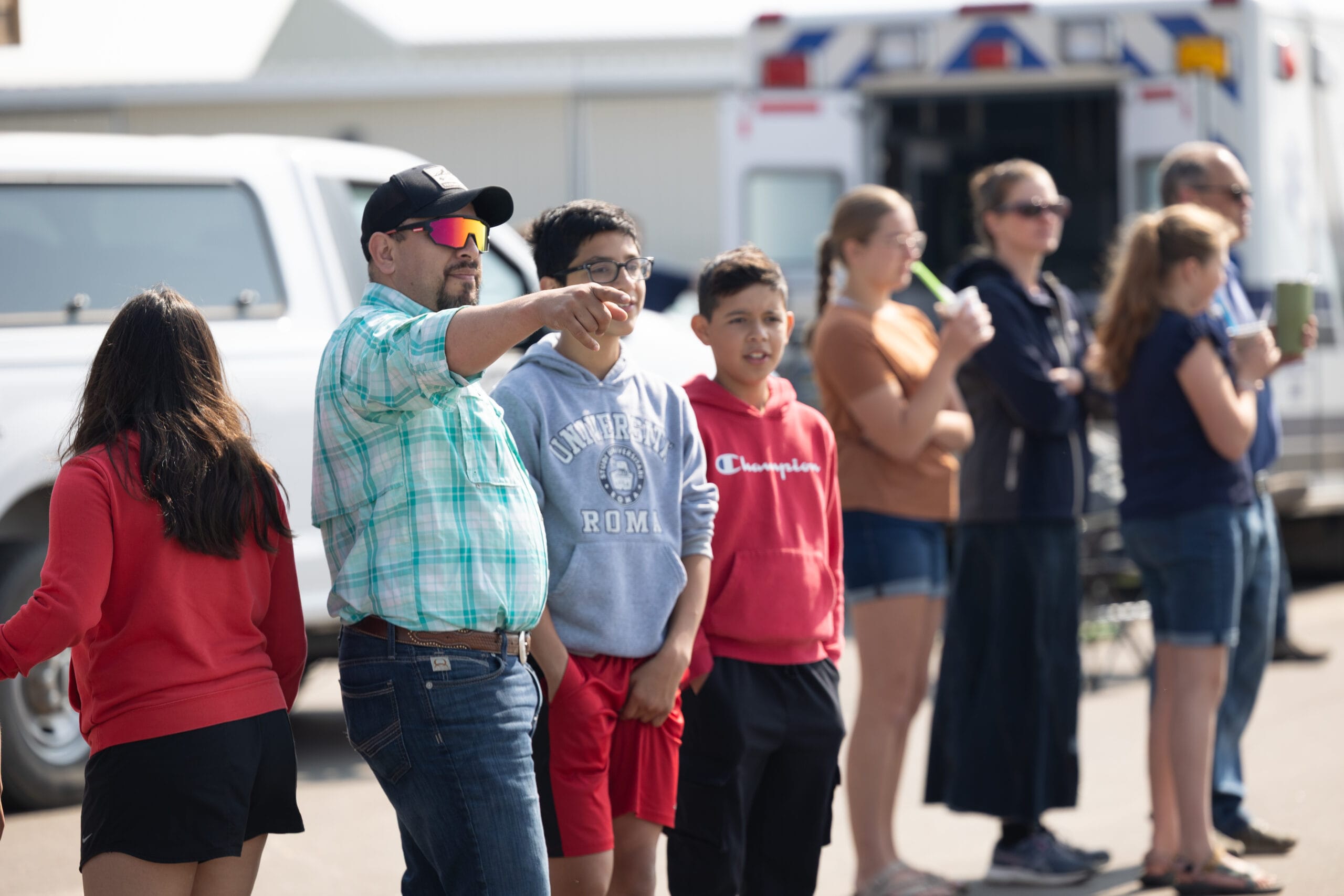 Families enjoying live music and ice cream at airport event