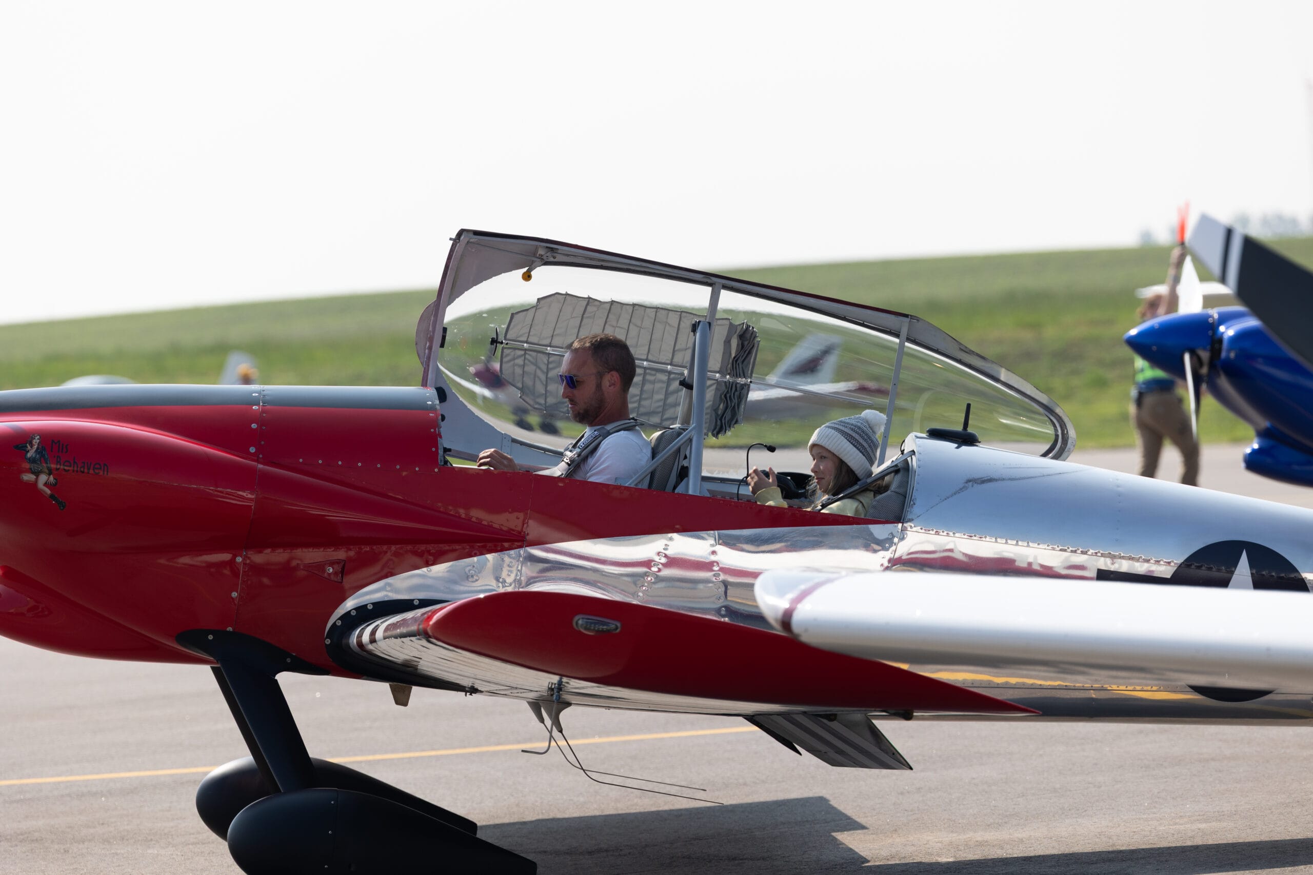 Families and airplanes at Cream of the Prop Fly-In