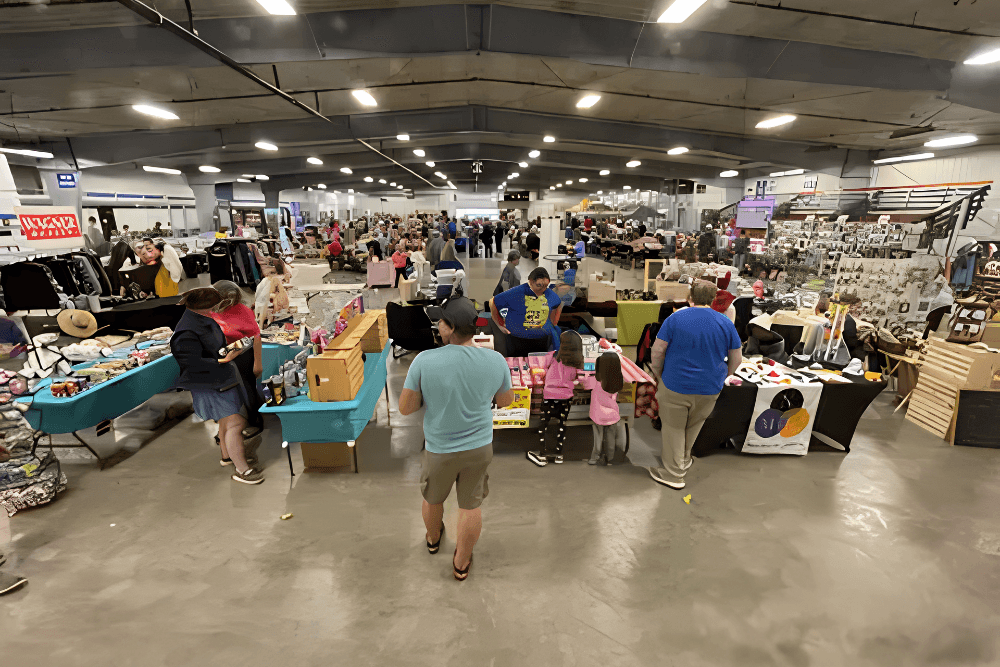 Visitors browsing local artisan and vendor booths at Prairie Harvest Fest
